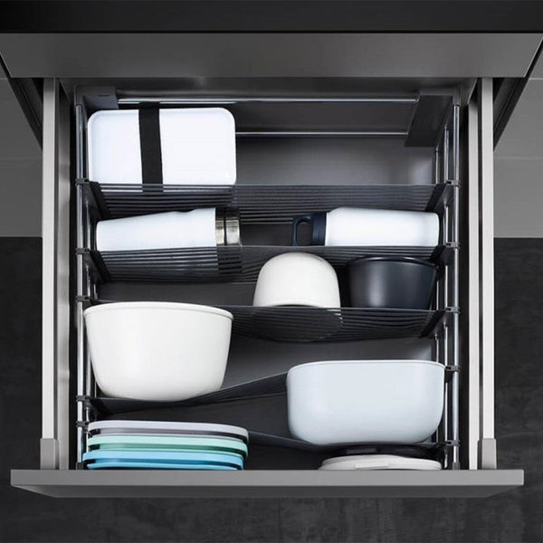 Spaceflexx Drawer Organisation installed in kitchen drawer to organise tupperware